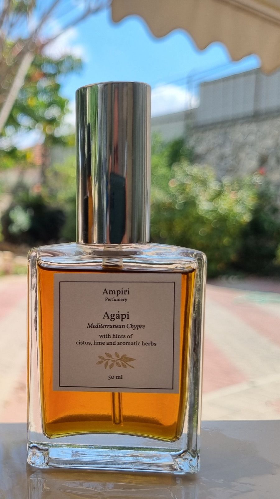 A 50 ml bottle of Agápi eau de parfum.