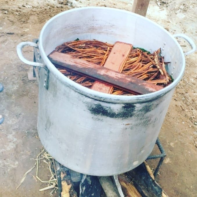 Pot with wood pieces, at Ampiri.