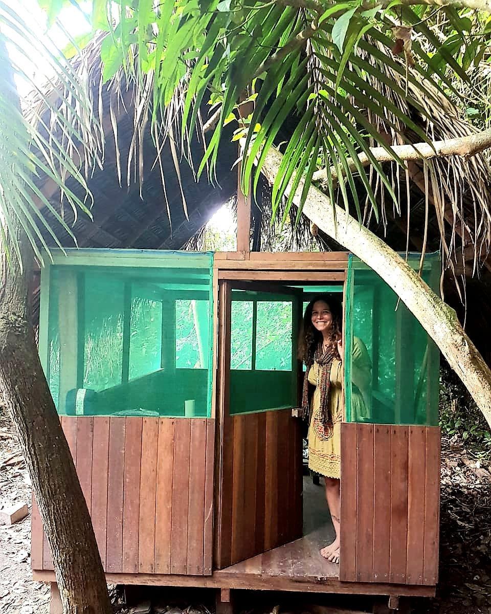 Green hut with tiny figure, at Ampiri.