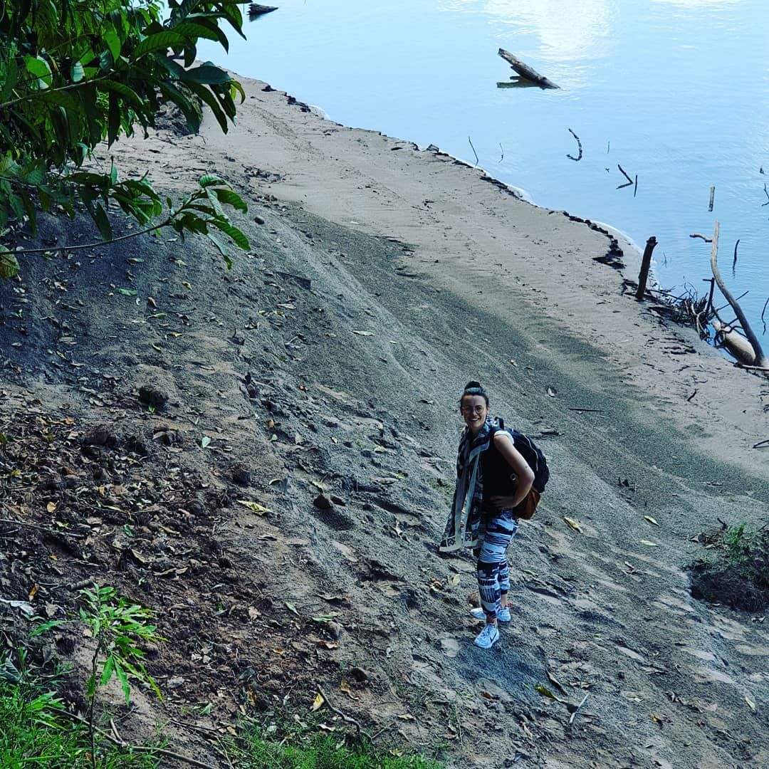 Person on sandy bank, tiny, at Ampiri.