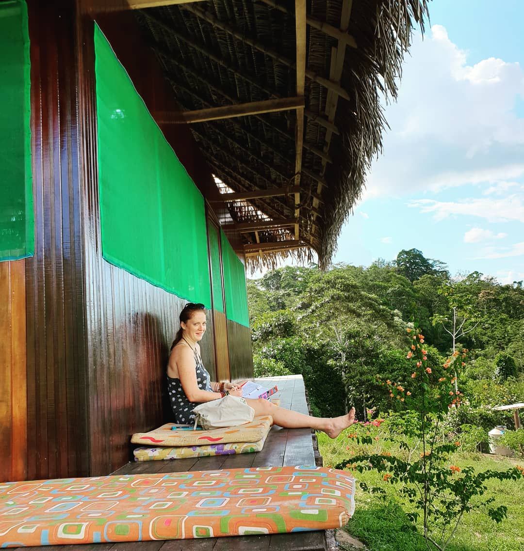 Woman in hut doorway, small, at Ampiri.