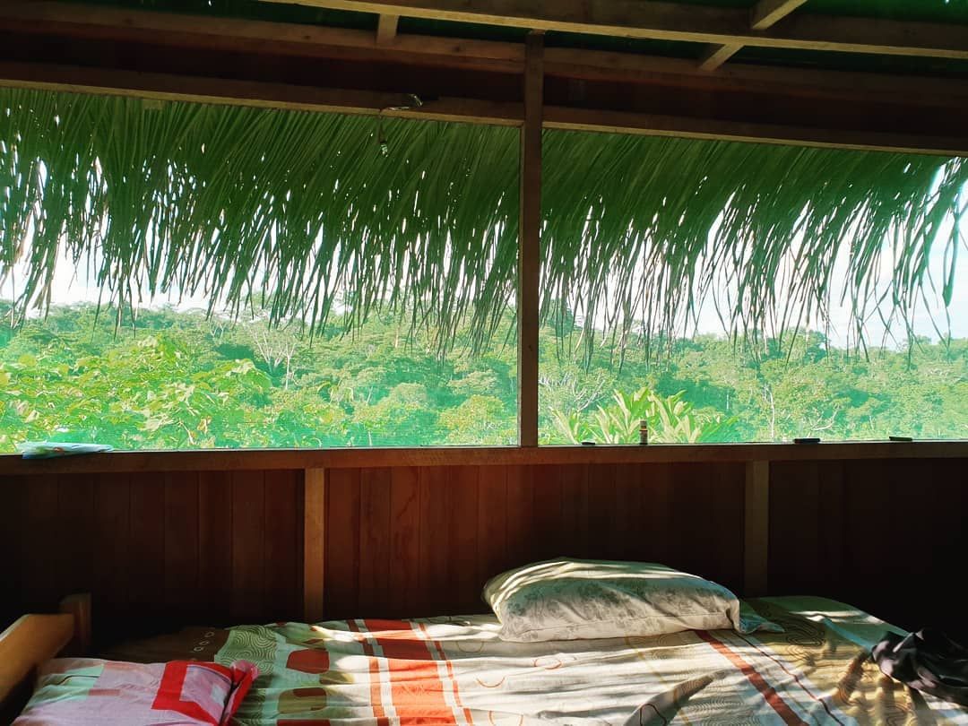 Interior with grass roof, at Ampiri.