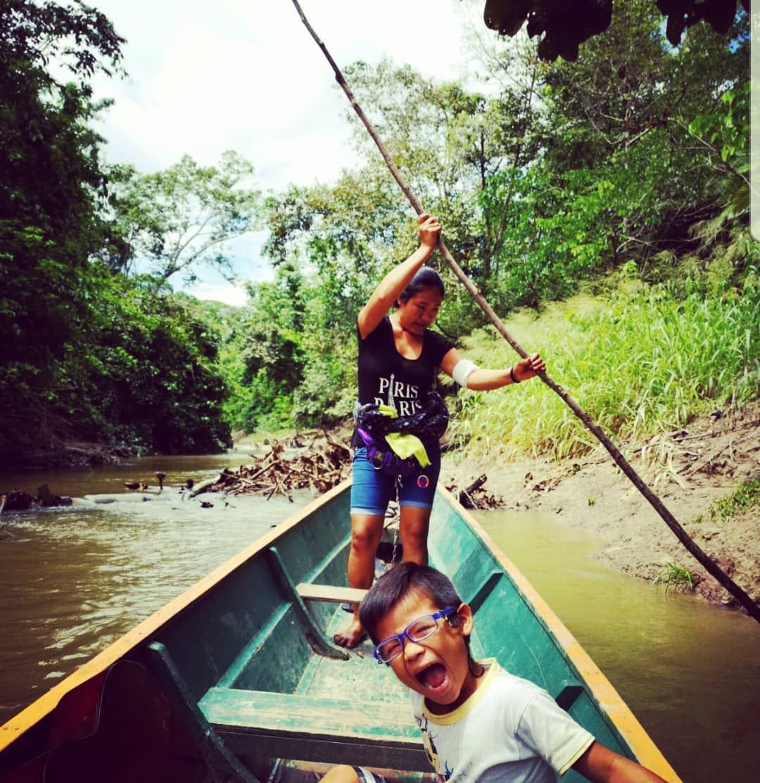 Man poling canoe, small, at Ampiri.