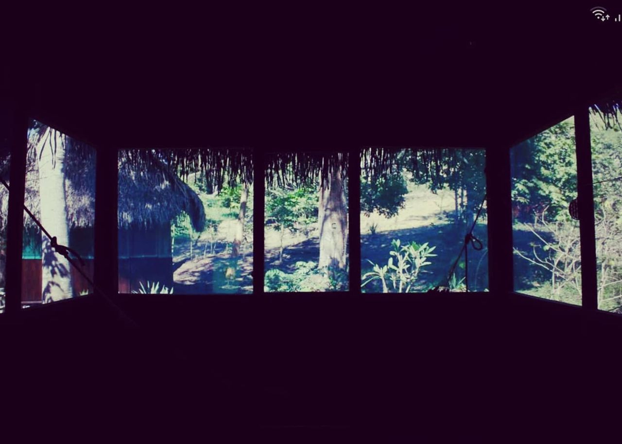 Dark window frame, no clear subject, at Ampiri.